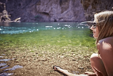 girl hanging out by river